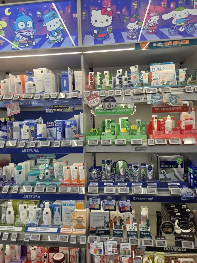 Olive Young derma care shelves under a sign reading 바르는 습윤 장벽 케어, moisture-retention barrier care, with rows of electronic price labels